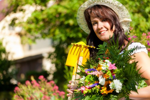 Professional landscapers enhancing curb appeal of a Putney home